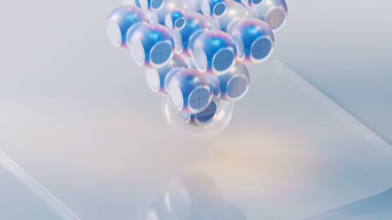 Iridescent spheres floating on white