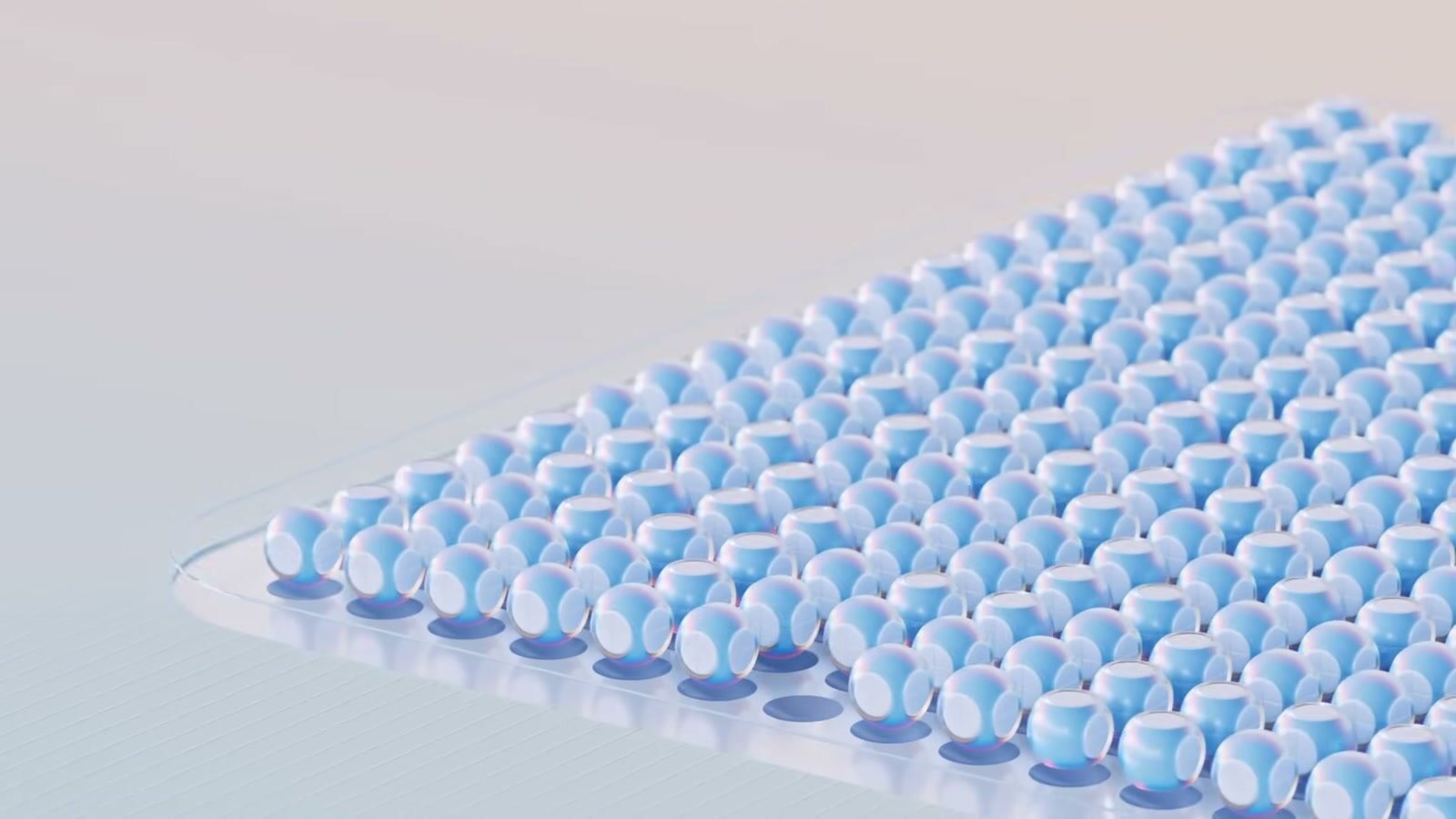Spheres settling into an ordered tray