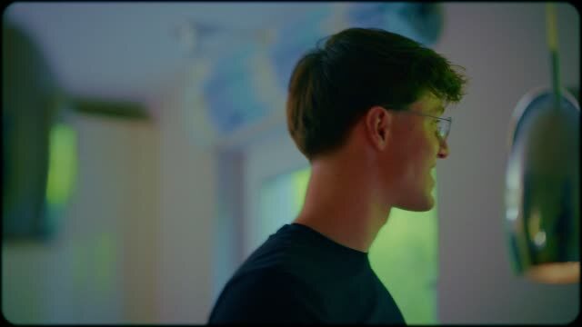 A founder in profile during an interview