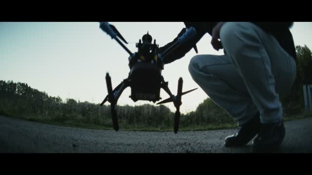 An engineer preparing a drone before a test flight